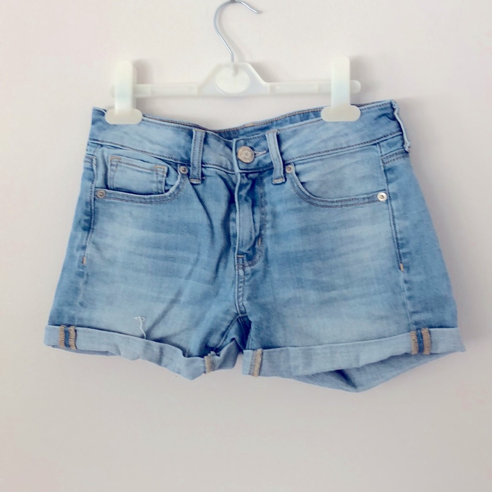 AE super stretch midi light denim shorts.